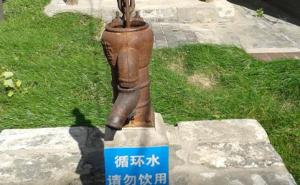 The sign beneath this outdoor water pump at the Beijing Museum of Tap Water supposedly warns visitors not to drink the water.